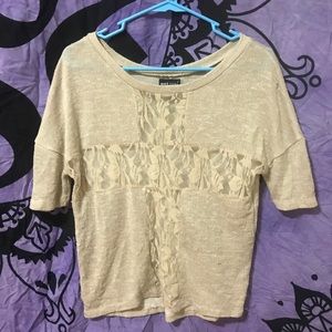 Tan knit top with lacey floral cross